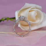 0.60ct Oval Cut Moissanite, Classic Halo Engagement Ring, Available in White Gold or Platinum with Rose Gold Detailing